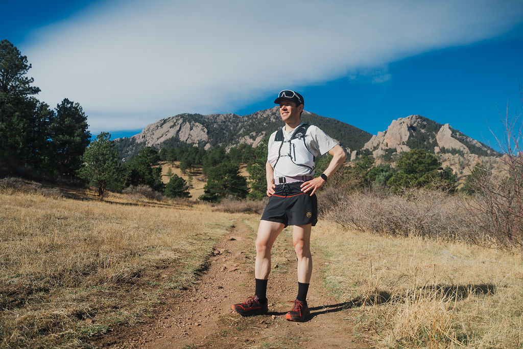 John Tribbia on Shanahan Trail with the Flatirons behind — Prodigio 2 in testing
